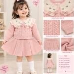 🌸 Pink Blossom Knit Skirt Set Colour: Soft Blush Pink & Cream Set Includes: Knitted Cardigan + Matching Flared Skirt